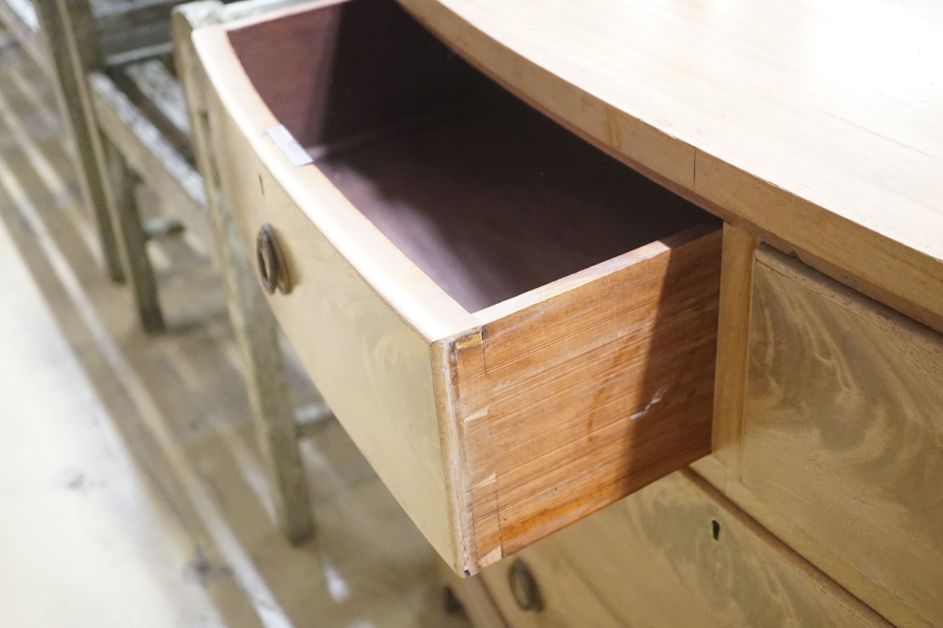 A Regency faded mahogany bow-front chest of three long drawers, width 120cm depth 51cm height 77cm